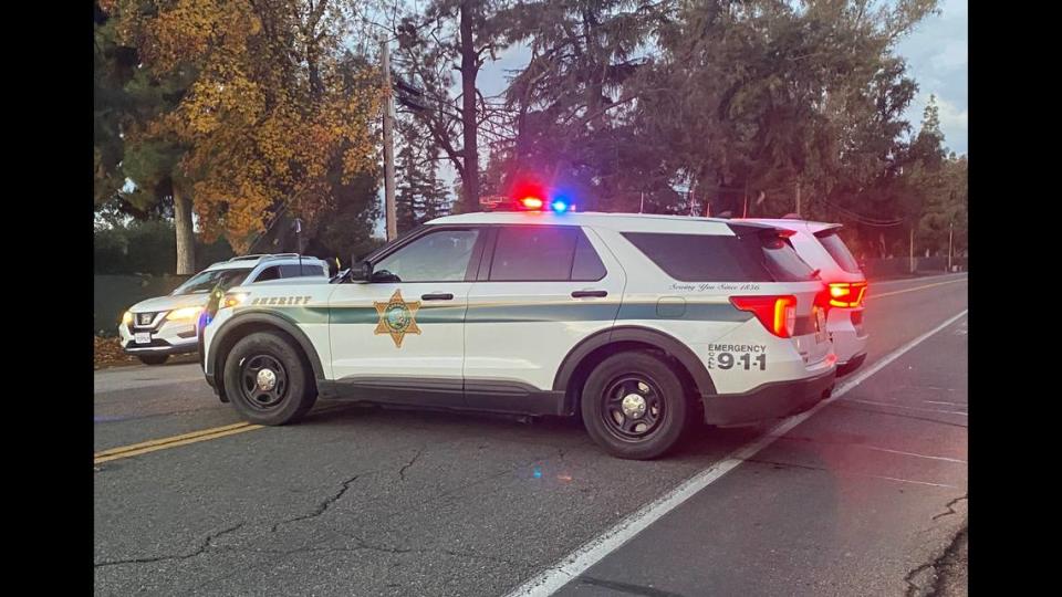 A Fresno County Sheriff’s cruiser blocks Belmont Avenue on Tuesday, Dec. 6, 2022.
