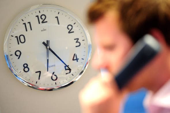 clock and man on phone