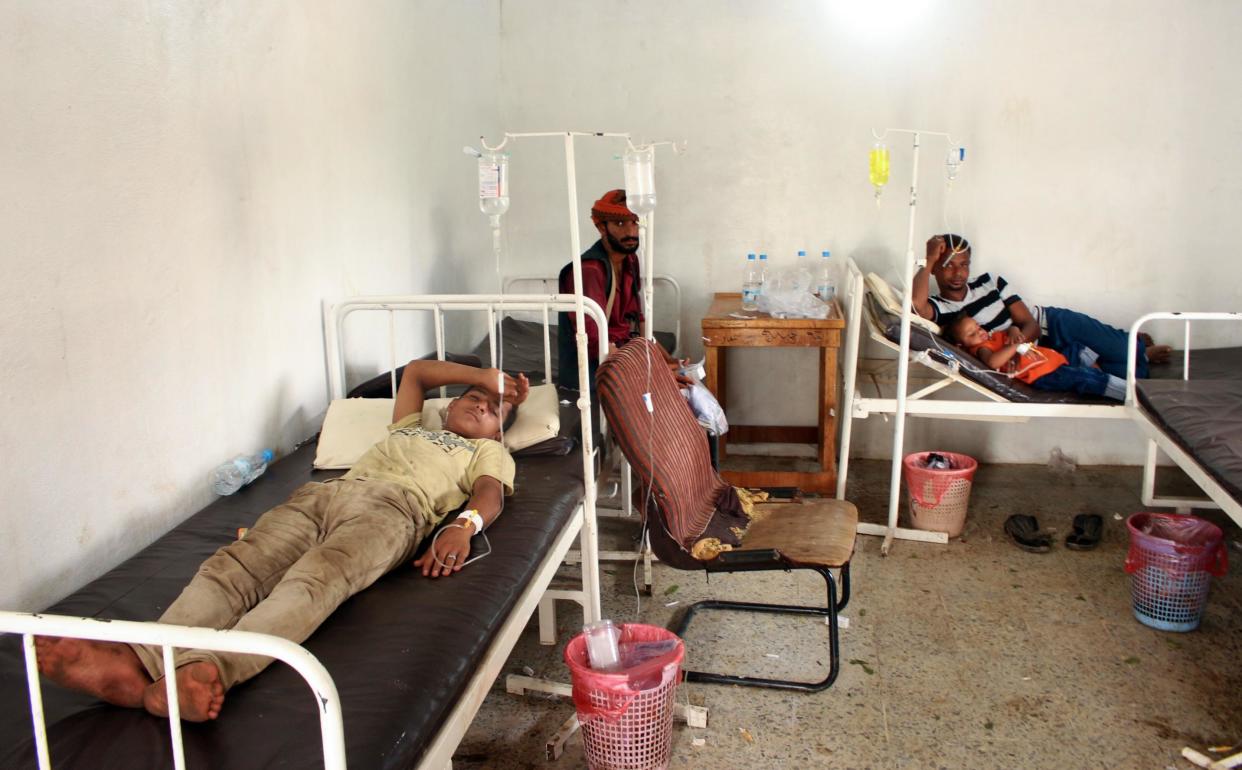 Yemenis displaced from an area near the Saudi border and believed to be suffering from dengue fever, rest in the clinic of a makeshift camp in the country's northern Hajjah province, on October 19, 2019: AFP/Getty