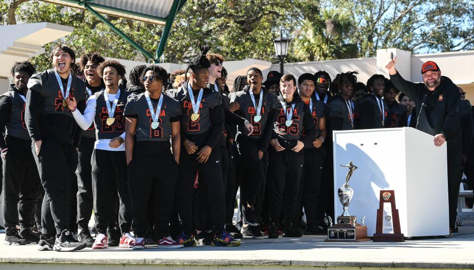 Cocoa football coach Ryan Schneider and his team celebrate the Tigers’ fifth state championship with supporters and fans in Riverfront Park Saturday, January 7, 2023. Craig Bailey/FLORIDA TODAY via USA TODAY NETWORK