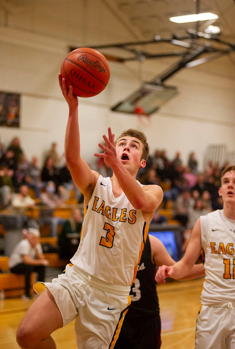 Colonel Crawford's Derek Horsley slips through the Crestview defense for an easy layup.