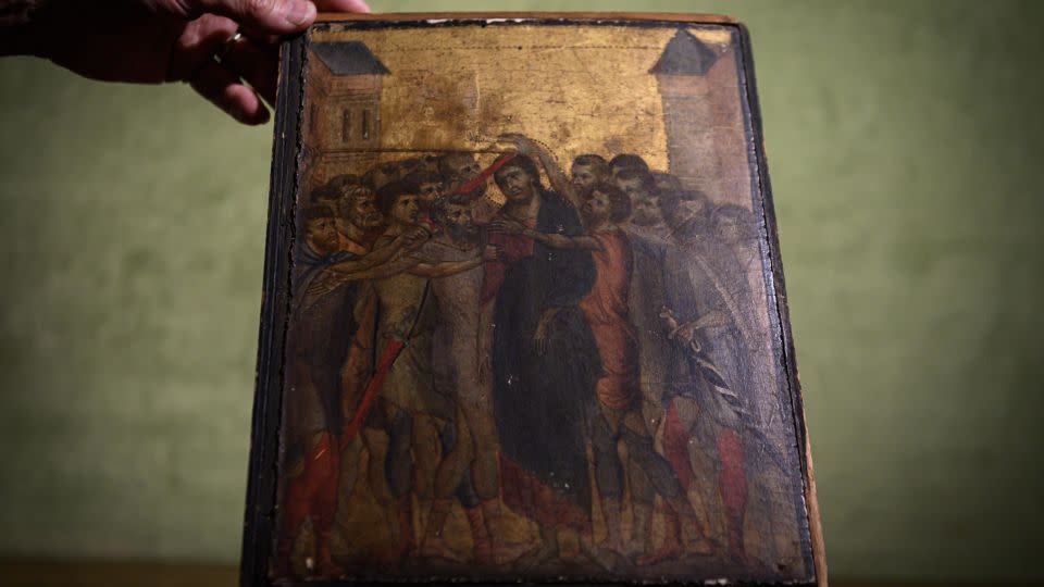 This photo taken on September 23, 2019 in Paris shows a painting titled "the Mocking of Christ" by the late 13th century Florentine artist Cenni di Pepo also known as Cimabue. - Philippe Lopez/AFP/Getty Images