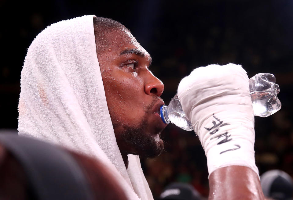 Anthony Joshua (centre) appears dejected after losing to Andy Ruiz Jr in the WBA, IBF, WBO and IBO Heavyweight World Championship match at Madison Square Garden, New York.