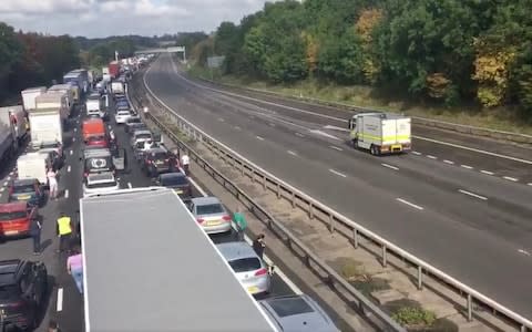 Police on the M1 - Credit: Twitter/@SarahByrdITV