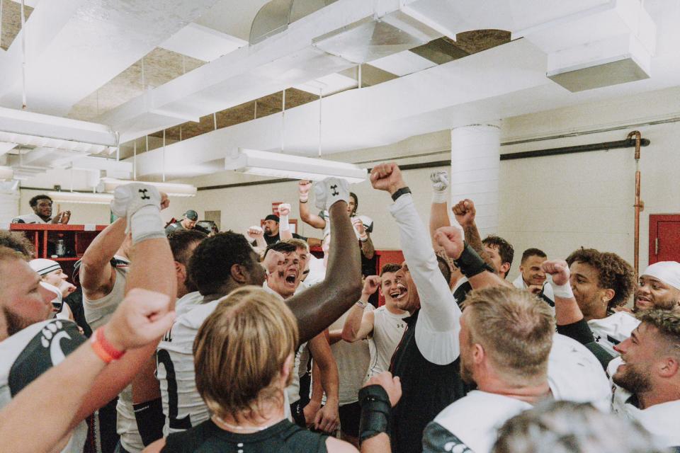 Cincinnati head coach Luke Fickell leads a round of celebration after the Bearcats rallied to beat the Hoosiers. (Special to Yahoo Sports) 