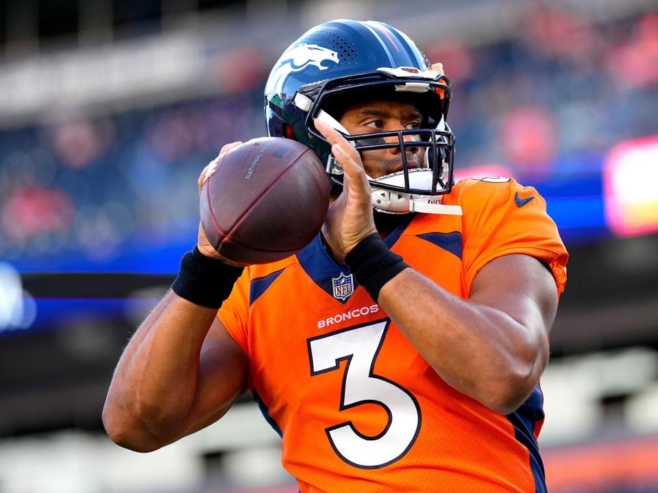 Russell Wilson warms up ahead of a preseason game against the Minnesota Vikings.