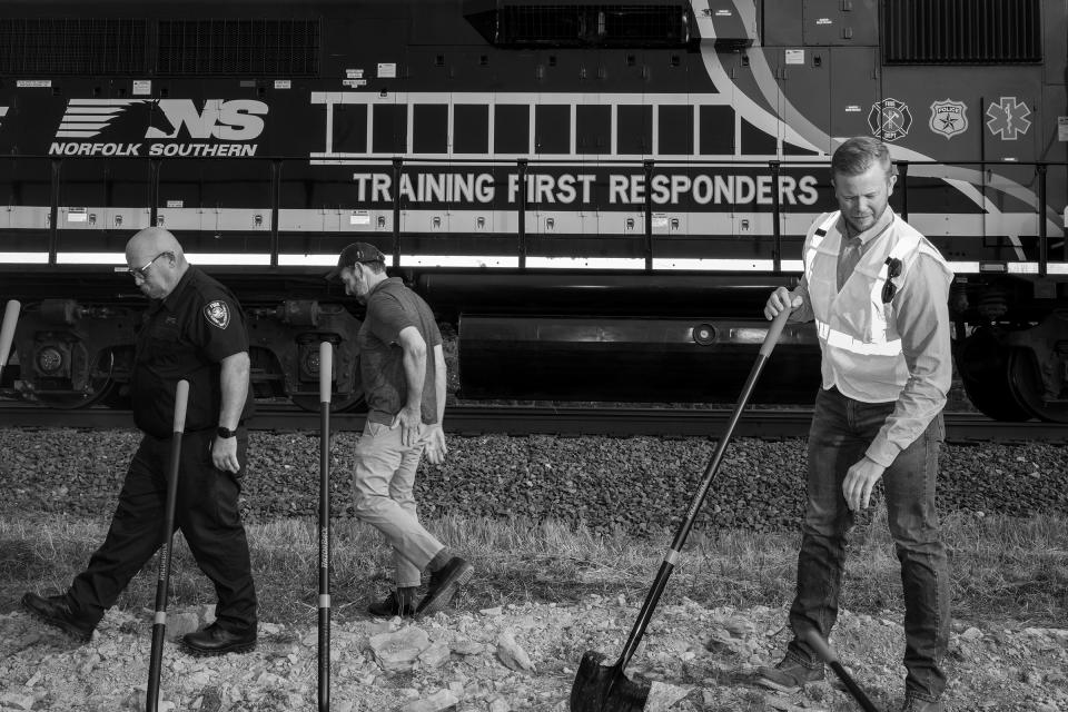 Railroad executives and local leaders break ground for a $25 million regional first responder training center being constructed by Norfolk Southern on Sept. 21. From left: Keith Drabick, the town's fire chief; Mike Rulli, Ohio state senator; and John Fleps, Norfolk Southern's VP of safety.<span class="copyright">Rebecca Kiger for TIME</span>