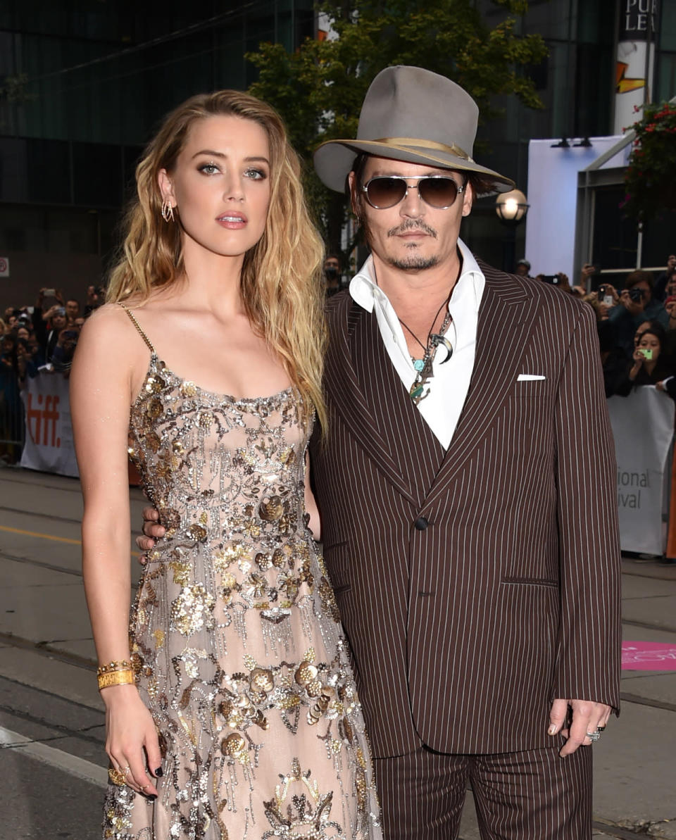 Amber Heard and Johnny Depp: Depp kept things cool in a brown pinstripe suit. 