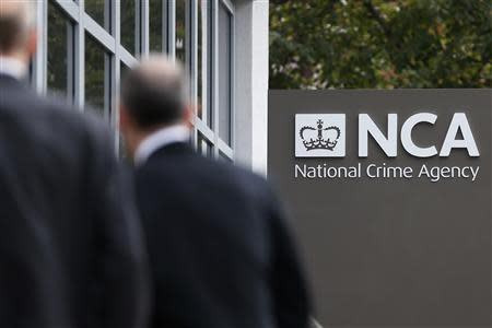 Pedestrians walk past the National Crime Agency (NCA) headquarters in London October 7, 2013. REUTERS/Stefan Wermuth