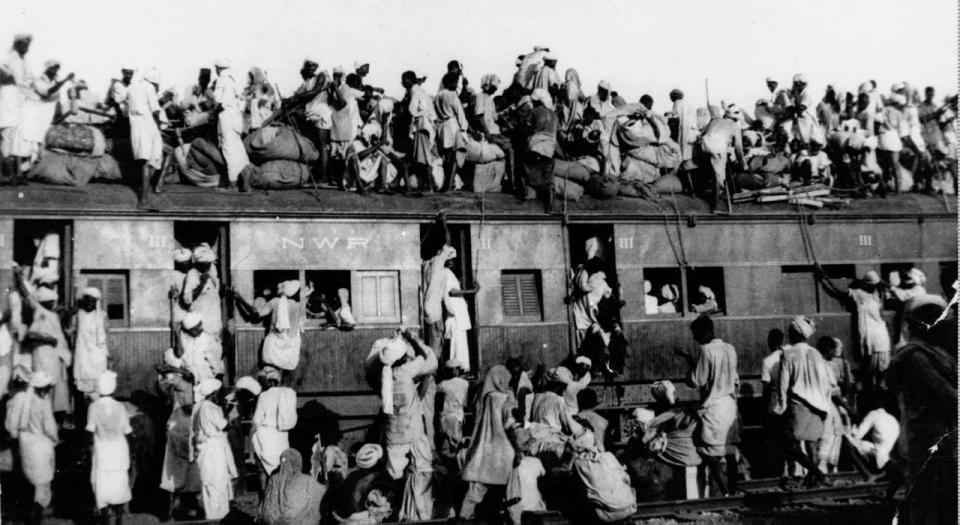 INDIA 70TH ANNIVERSARY: Hundreds of Muslim refugees crowd atop a train leaving New Delhi for Pakistan in this September 1947 file photo. India will celebrate its 70th anniversary of Independence from Britian on Sunday,  Aug 15, 2016. The day also marks the division of the British empire into officially Muslim Pakistan and largely Hindu India. That division was accompanied by bloody religious riots in 1947, the memories of which haunt freedom celebrations. (AP Photo)