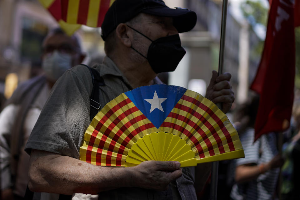 A pro-independence demonstrator attends a protest against Spain's prime minister Pedro Sanchez outside the Gran Teatre del Liceu in Barcelona, Spain, Monday, June 21, 2021. Sanchez's said Monday that the Spanish Cabinet will approve pardons for nine separatist Catalan politicians and activists imprisoned for their roles in the 2017 push to break away from Spain. (AP Photo/Joan Mateu)
