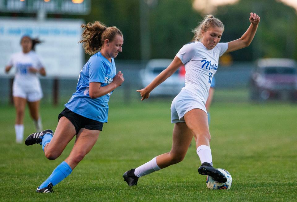 Marian's Teagan Montague, right, shown here on Sept. 28, 2021 against Saint Joseph.