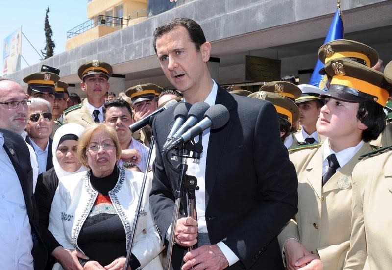 President Bashar al-Assad addresses his supporters at a school in an undisclosed location during an event to commemorate Syria's Martyrs' Day May 6, 2015 in this handout provided by SANA. REUTERS/SANA/Handout via Reuters 