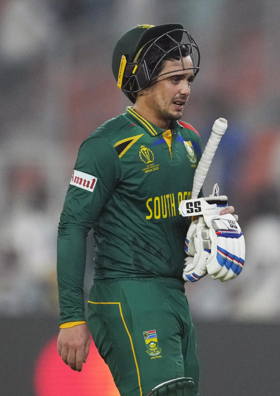South Africa's Quinton De Kock leaves the ground after losing his wicket during the ICC Men's Cricket World Cup match between Afghanistan and South Africa in Ahmedabad, India, Friday, Nov. 10, 2023. (AP Photo/Ajit Solanki)