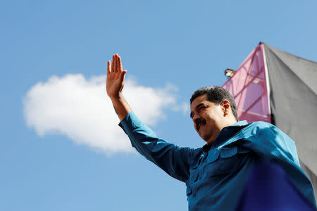 Venezuela's President Nicolas Maduro waves as he arrives for a rally to commemorate the 60th anniversary of the end of Venezuelan dictator Marcos Perez Jimenez's regime in Caracas, Venezuela January 23, 2018. REUTERS/Marco Bello