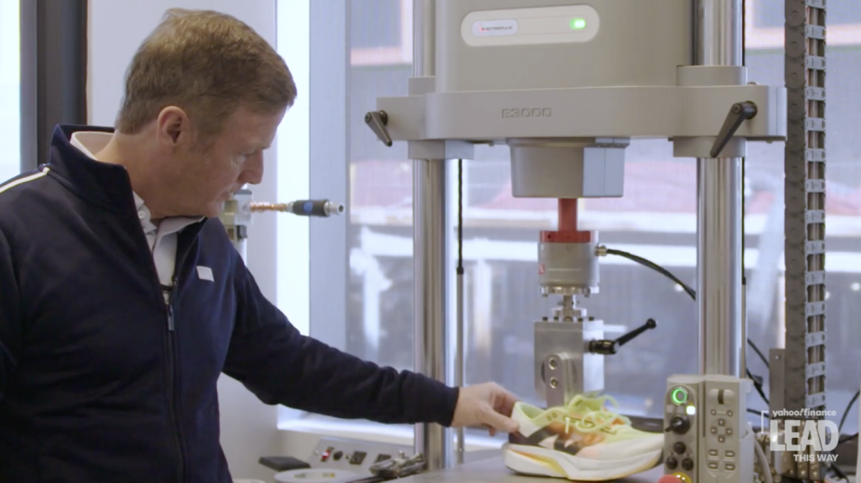 New Balance CEO Joe Preston evaluates FuelCell running shoe at the company's research lab.