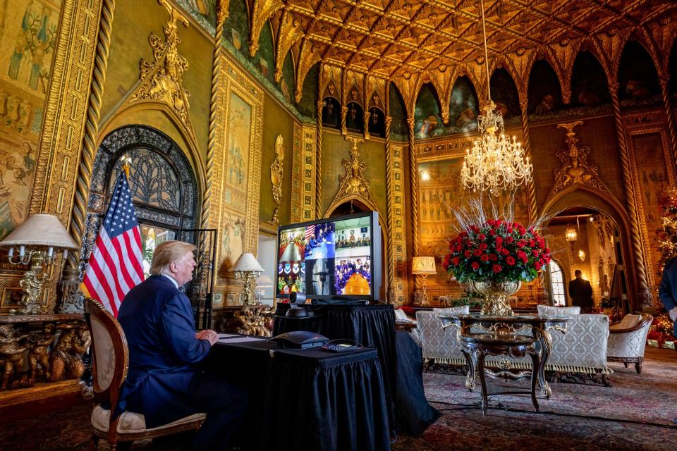 President Donald Trump makes a Christmas Eve video conference call to members of the armed forces from Mar-a-Lago on December 24, 2019.