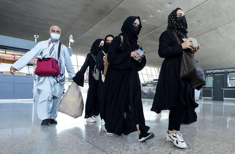 FILE PHOTO: Afghan refugees arrive at Dulles Airport in Virginia