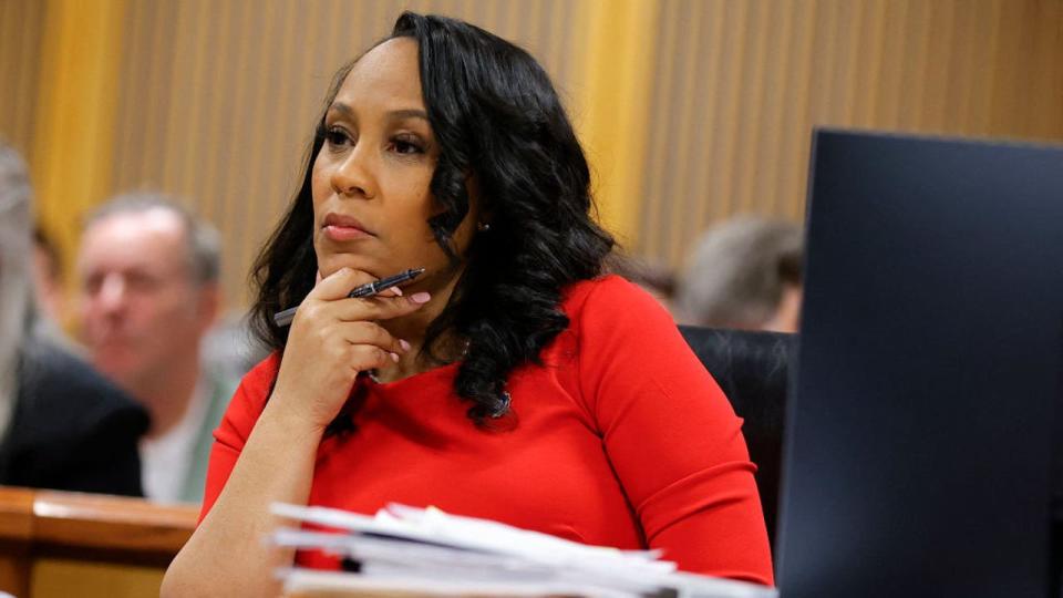 <div>Fulton County District Attorney Fani Willis listens during the final arguments in her disqualification hearing at the Fulton County Courthouse on March 1, 2024, in Atlanta. (Photo by ALEX SLITZ/POOL/AFP via Getty Images)</div>