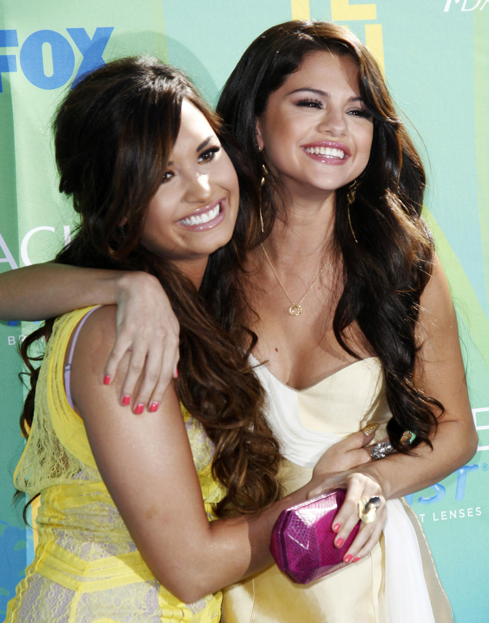 Demi Lovato and Selena Gomez pose together at the 2011 Teen Choice Awards. (Danny Moloshok/Reuters)