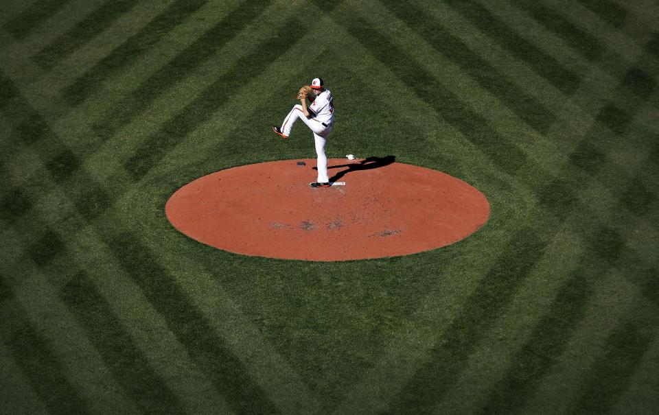 Baltimore Orioles starting pitcher Chris Tillman throws to the Boston Red Sox in the third inning of an opening day baseball game, Monday, March 31, 2014, in Baltimore. (AP Photo/Patrick Semansky)