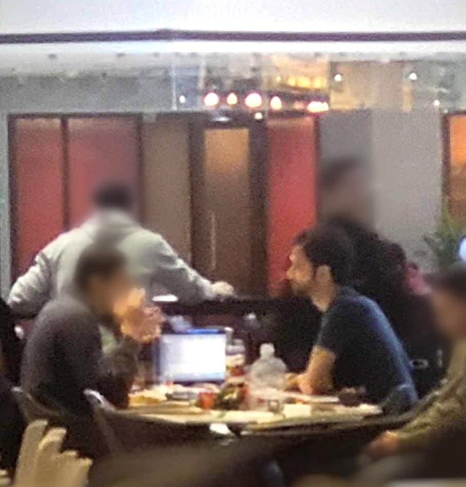 This photo of the meeting between Kamal Sehaki, right, and a man claiming to be an Algerian consular agent, left, was taken in the food court of the Complexe Desjardins in Montreal on May 11. 