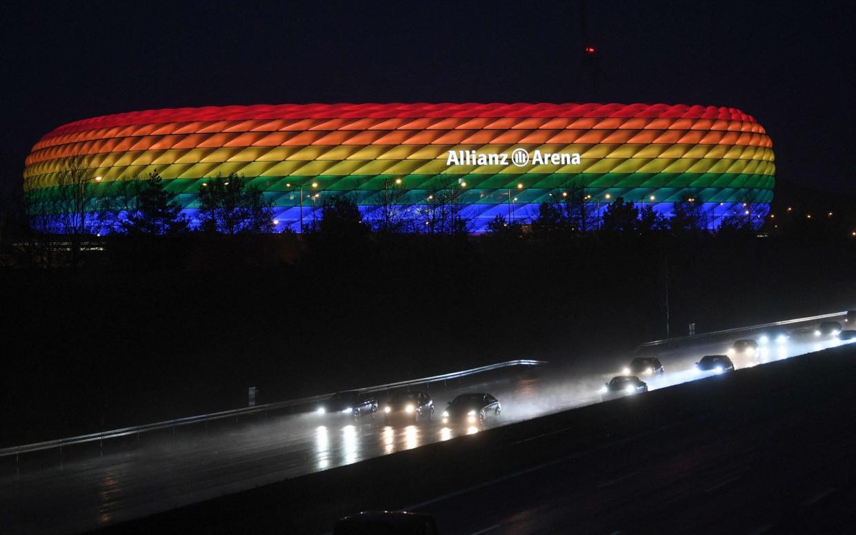 The Allianz Arena illuminated in rainbow colours after the German first division Bundesliga football match FC Bayern Munich v TSG 1899 Hoffenheim in Munich - ANDREAS GEBERT/POOL/AFP VIA GETTY IMAGES