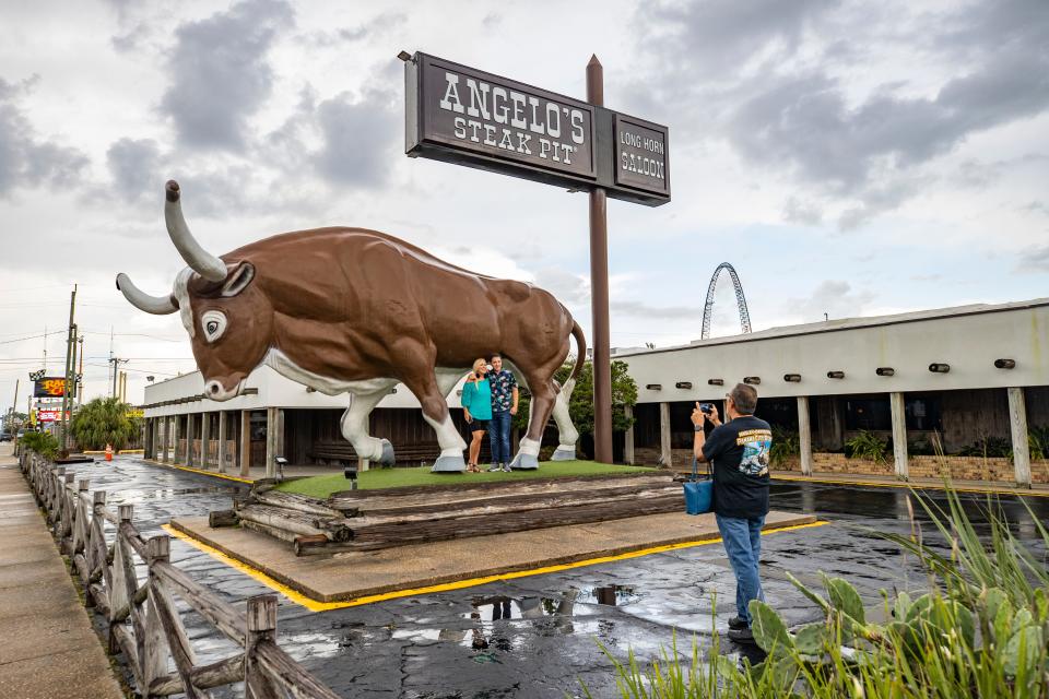 'Big Gus' the 20,000 lb. steer greets visitors and serves a a photo op location outside Angelo's Steak Pit in Panama City Beach. The restaurant opened in 1958 and seats over 700 diners.