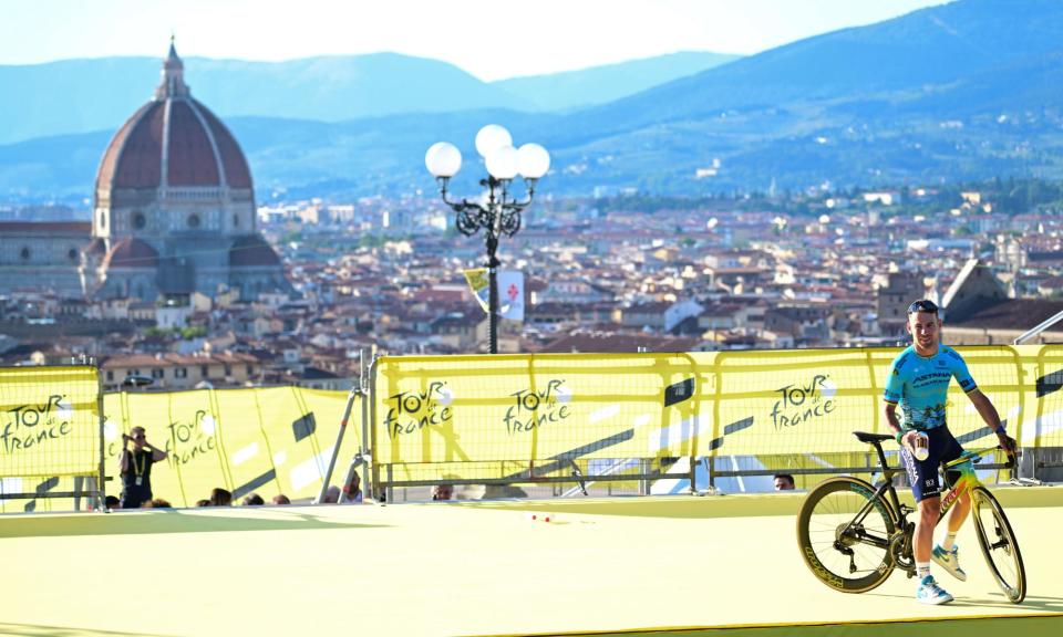 <span>Mark Cavendish rides on to the stage for the team presentations in Florence this week.</span><span>Photograph: Goding Images/Shutterstock</span>