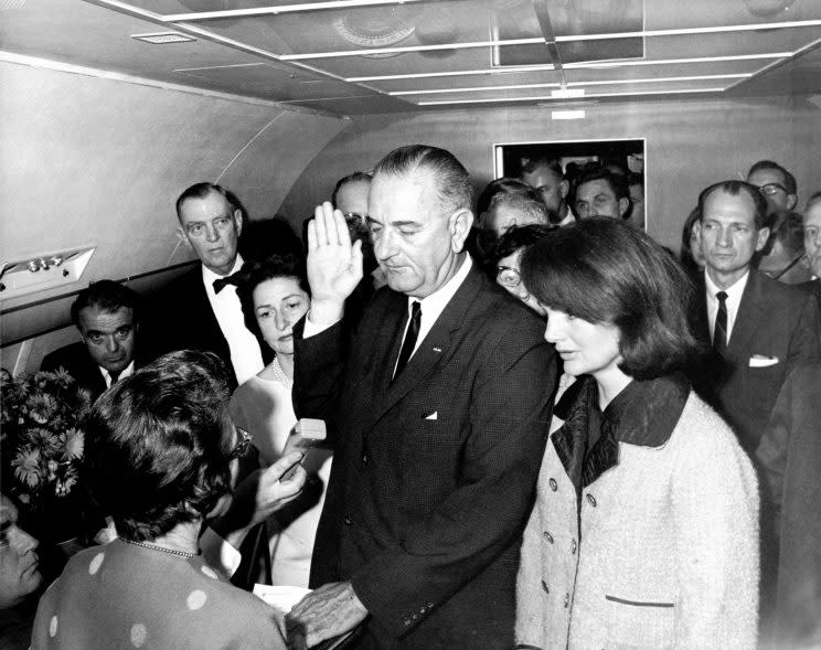 Kennedy next to then-Vice President Lyndon Baines Johnson as he took the oath of office. (Photo: Universal History Archive/Getty Images)