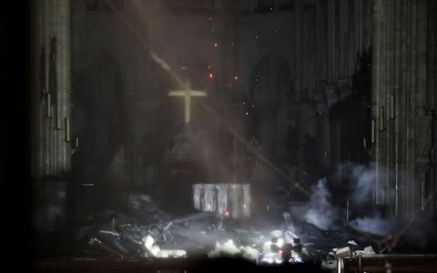 Inside Notre-Dame amid the ashes - Credit: Rex