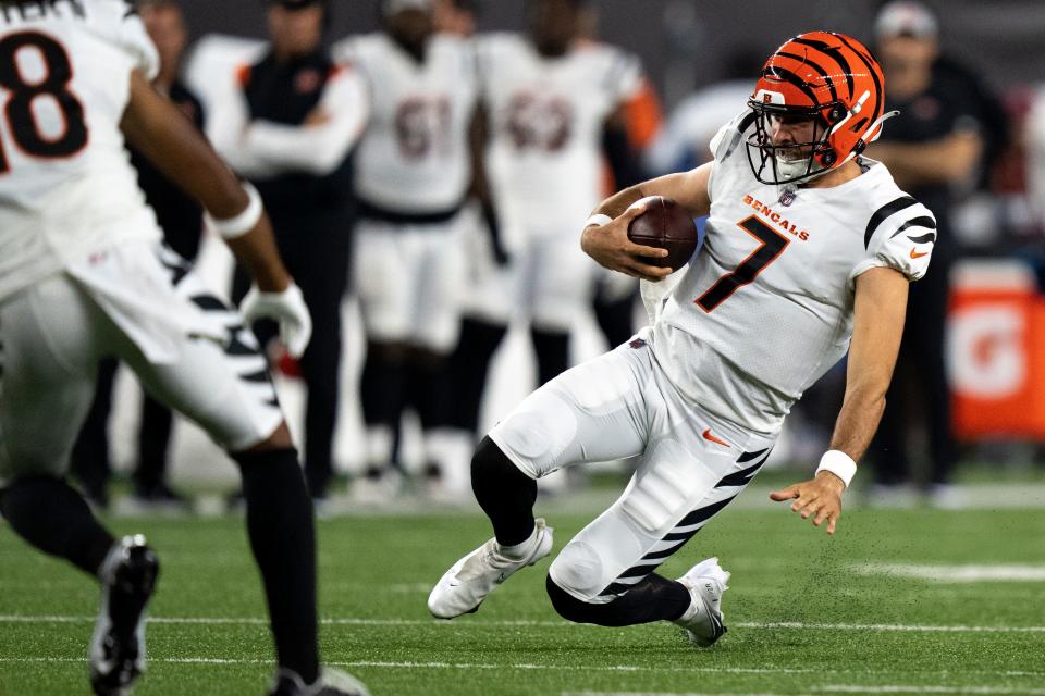 Cincinnati Bengals quarterback Drew Plitt (7) dives after scrambling out of the pocket in the second half of the NFL preseason game between the Cincinnati Bengals and the Arizona Cardinals at Paycor Stadium Aug. 12.