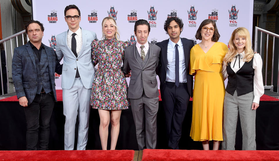 Johnny Galecki, Jim Parsons, Kaley Cuoco, Simon Helberg, Kunal Nayyar, Mayim Bialik, and Melissa Rauch pose together on a red carpet for The Big Bang Theory