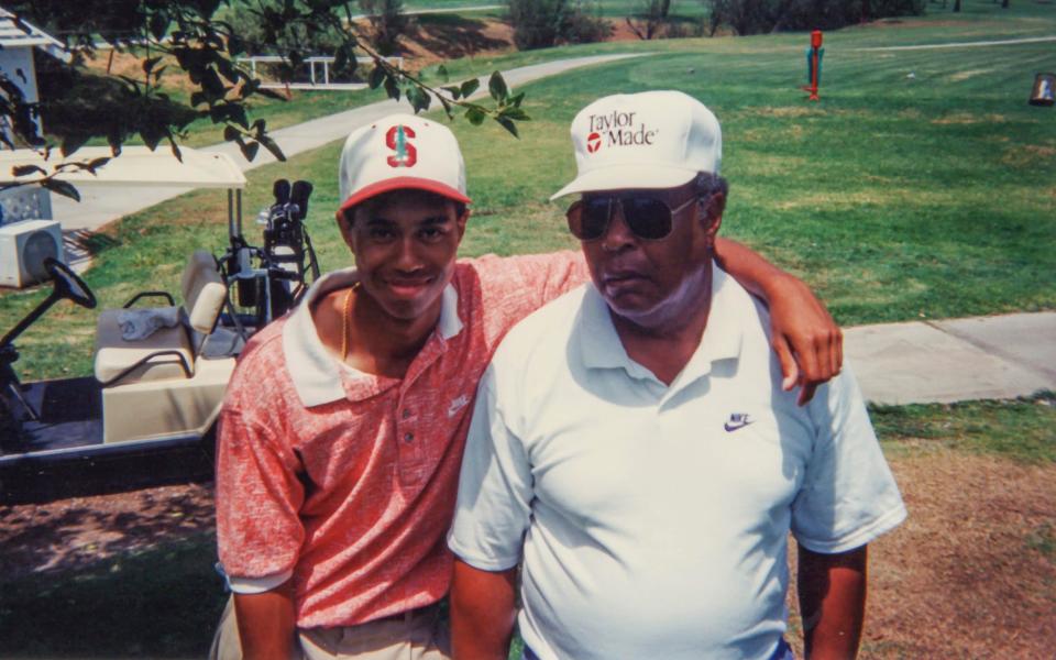 A young Tiger Woods with his father, Earl - HBO