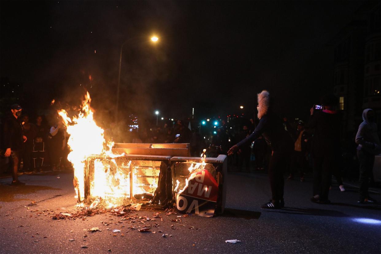 Protesters in Philadelphia burn a barricade on Tuesday night after the killing of Walter Wallace (AFP via Getty Images)