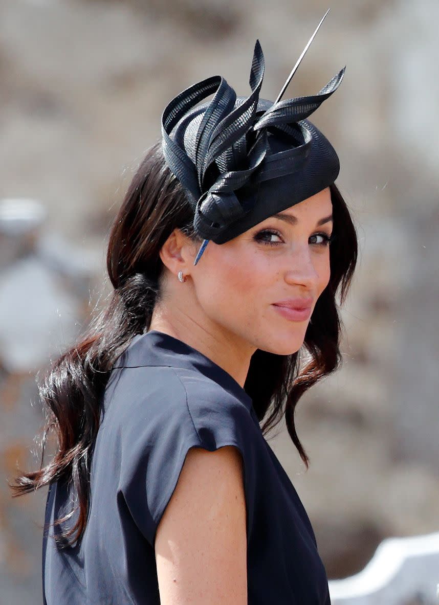Meghan sporting a fascinator and loose waves in 2018