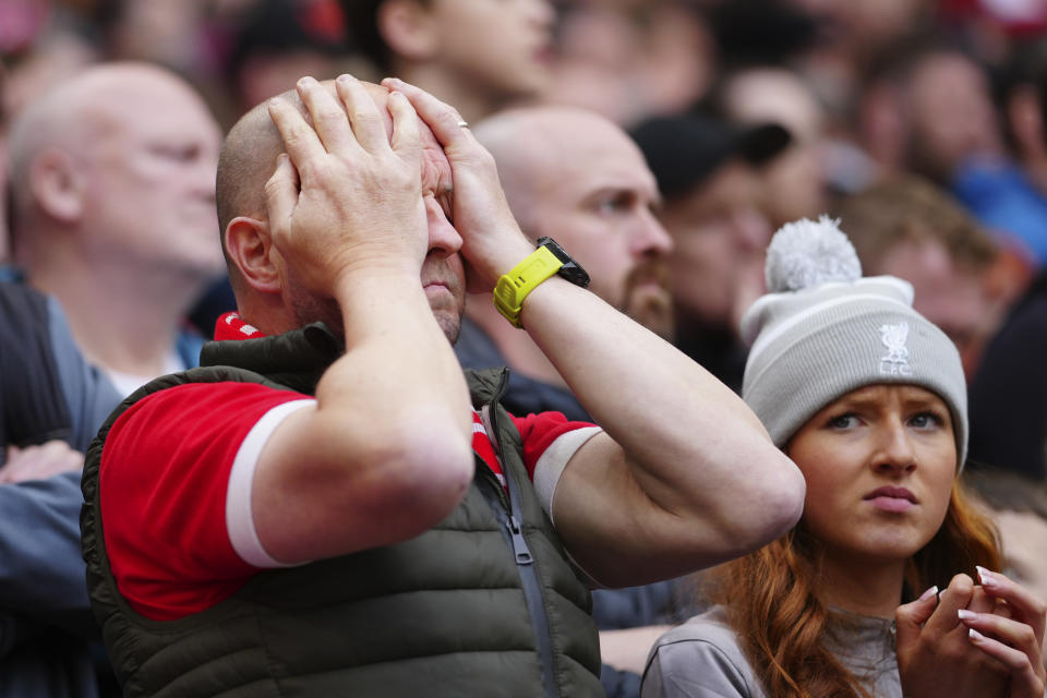 Disappointed Liverpool fans during the English Premier League soccer match between Liverpool and Crystal Palace at Anfield Stadium in Liverpool, England, Sunday, April 14, 2024. (AP Photo/Jon Super)