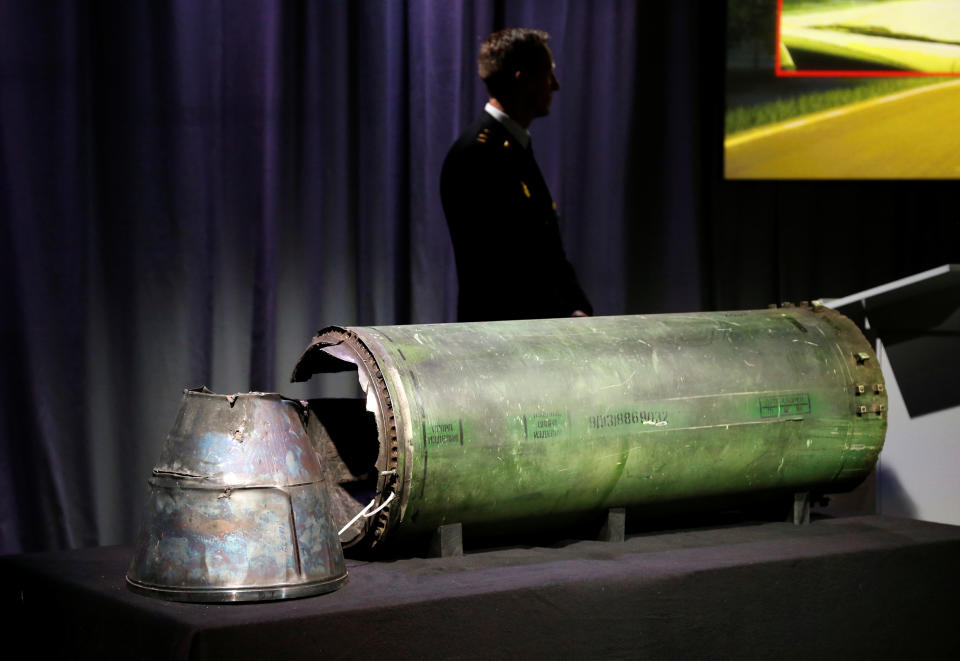 A damaged missile is displayed during a news conference by members of the Joint Investigation Team, comprising the authorities from Australia, Belgium, Malaysia, the Netherlands and Ukraine who present interim results in the ongoing investigation of the 2014 MH17 crash that killed 298 people over eastern Ukraine, in Bunnik, Netherlands, May 24, 2018. REUTERS/Francois Lenoir