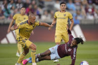 Real Salt Lake defender Erik Holt, left, knocks over Colorado Rapids forward Kévin Cabral, front right, in the first half of an MLS soccer match Saturday, May 20, 2023, in Commerce City, Colo. (AP Photo/David Zalubowski)