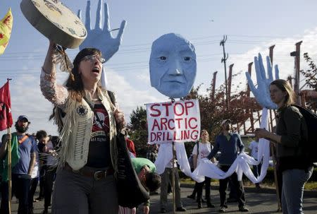 Activists march and rally at the entrance of Terminal 5 to protest Shell Oil Company's drilling rig Polar Pioneer which is parked at the Port of Seattle, Washington May 18, 2015. REUTERS/Jason Redmond