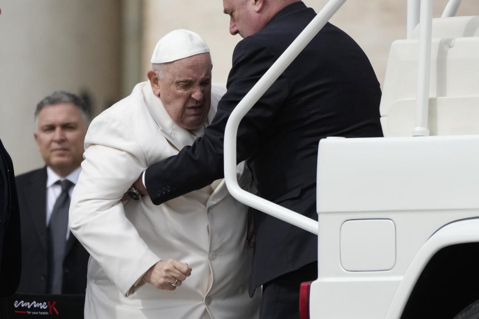 Pope Francis is helped to get back into his vehicle at the end of weekly general audience in St. Peter's Square, at the Vatican, March 29, 2023. / Credit: Alessandra Tarantino/AP