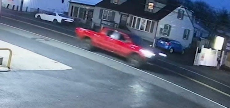 Surveillance video of the red Chevrolet Silverado moments before John Dugan was struck and killed in the 400 block of State Road in Croydon. Police believe this is the vehicle involved in the case.