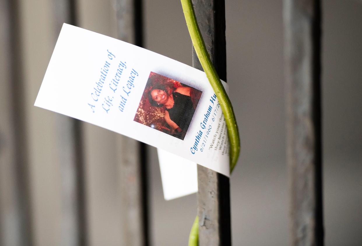 A card left on the stem of a flower celebrating the life of Cynthia Graham Hurd, on a gate outside of Mother Emanuel AME Church on the anniversary of the shooting seven years ago, in Charleston, S.C., Friday, June 17, 2022. 