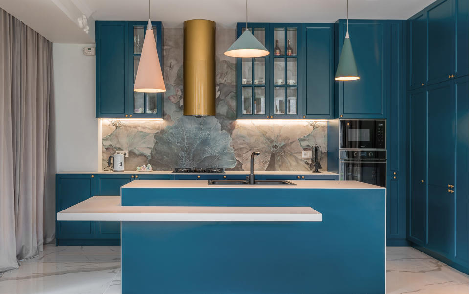 A blue painted kitchen with porcelain countertop