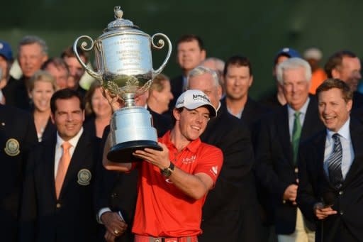 Rory McIlroy of Northern Ireland holds the trophy after winning the 94th PGA Championship, on August 12, on Kiawah Island, South Carolina. McIlroy blitzed the field on a marathon Sunday, claiming his second major title with a record-setting eight-shot victory on the wind-swept Ocean Course