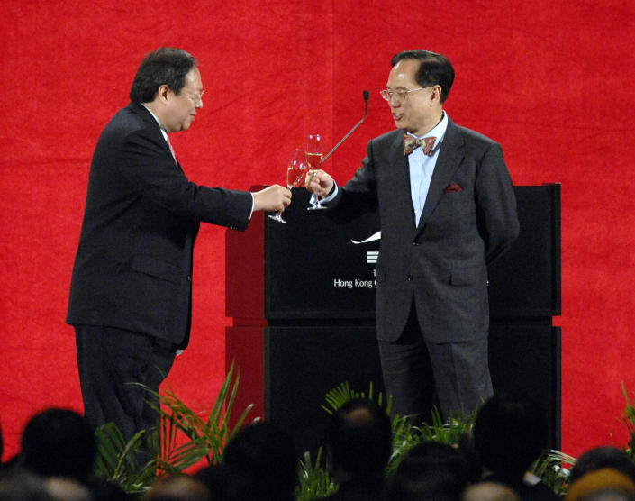 Donald Tsang, Hong Kong chief executive, right, toasts with Patrick Ho, secretary of home affairs for Hong Kong, at a reception hosted by Ho in Hong Kong in 2007. (Photo: Nelson Ching/Bloomberg via Getty Images)
