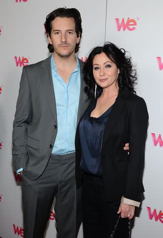 <p>Angela Weiss/Getty </p> Kurt Iswarienko (left) and Shannen Doherty (right)