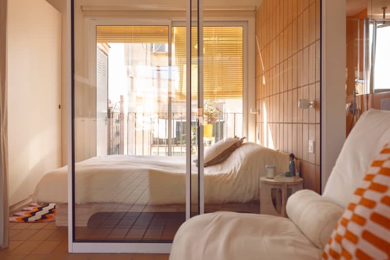 Sliding glass door in studio apartment.