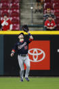 Washington Nationals' Lane Thomas catches a fly ball by the Cincinnati Reds during the ninth inning of a baseball game Thursday, Sept. 23, 2021, in Cincinnati. (AP Photo/Jay LaPrete)