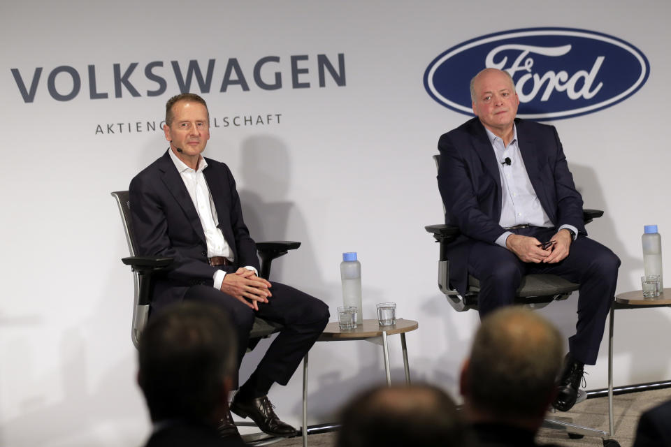 Ford CEO Jim Hackett, right, and Volkswagen CEO Herbert Diess participate in a news conference in New York, Friday, July 12, 2019. Volkswagen will sink $2.6 billion into a Pittsburgh autonomous vehicle company that's mostly owned by Ford as part of a broader partnership on electric and self-driving vehicles, the companies confirmed Friday. (AP Photo/Seth Wenig)